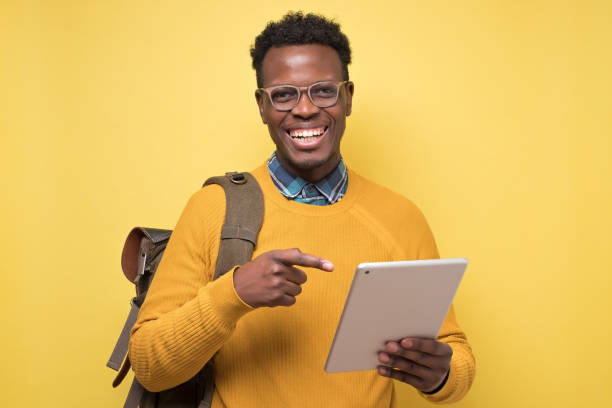 istock Happy african american college student holding table 1213335714