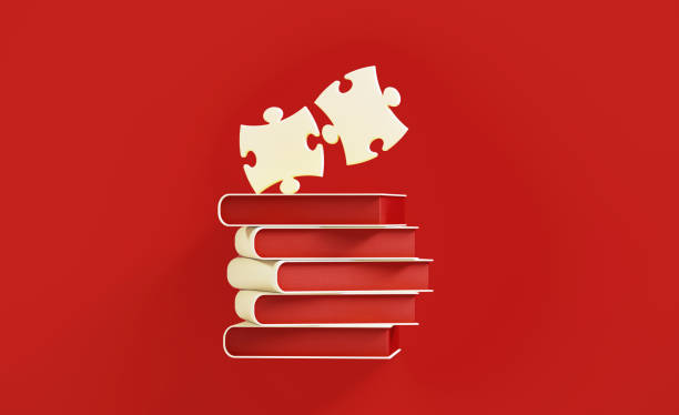 pile de livre blanc et morceaux blancs de puzzle de puzzle au-dessus du fond rouge - jigsaw puzzle teamwork puzzle red photos et images de collection