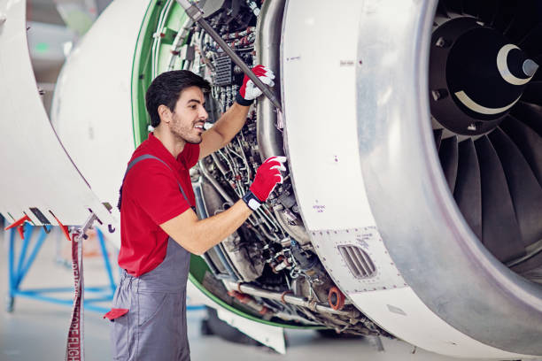istock Aircraft mechanic is working on the engine in the airplane hangar 1213337204