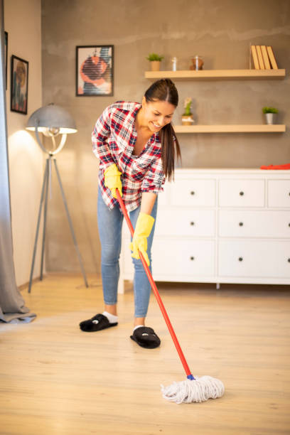 istock Young housewife doing house cleaning. 1213339931