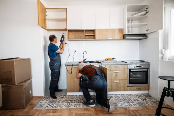 istock Two Senior Handymen assembling kitchen furniture 1213345458
