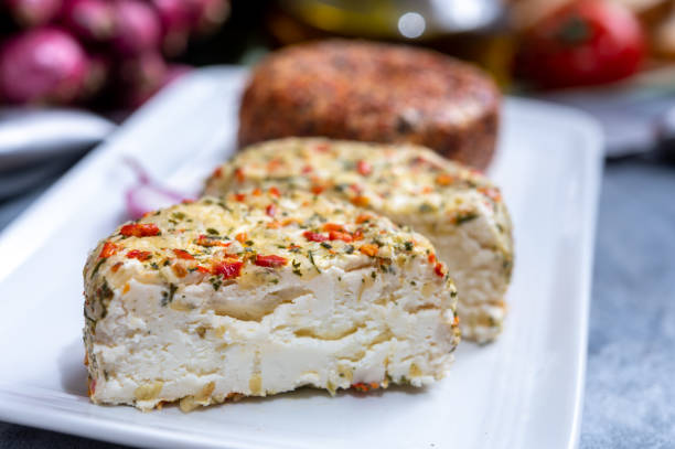 istock Different french soft goat cheeses made with spices and herbs 1213349008