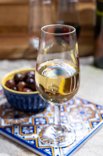Fortified wine from Andalusia, Spain, different types of sherry in glasses and olives, colors of Andalusisa Close up tasty  fortified wine from Andalusia, Spain, different types of sherry in glasses and olives, colors of Andalusisa jerez de la frontera stock pictures, royalty-free photos & images