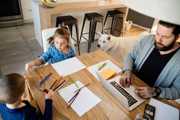 father working from home with young children in quarantine isolation covid-19 - tattoo father family son imagens e fotografias de stock