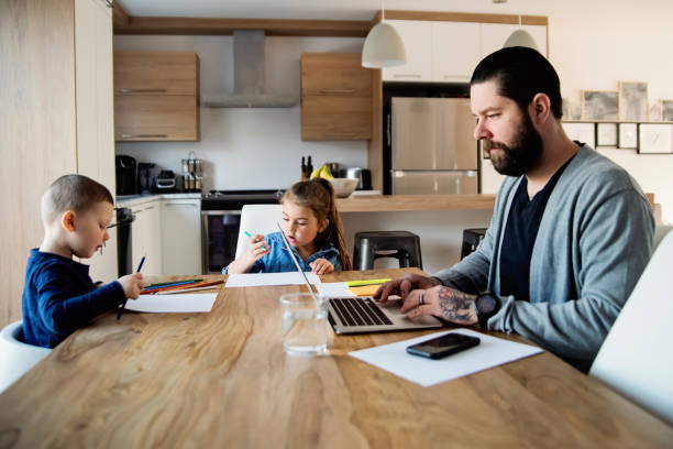 father working from home with young children in quarantine isolation covid-19 - tattoo father family son imagens e fotografias de stock