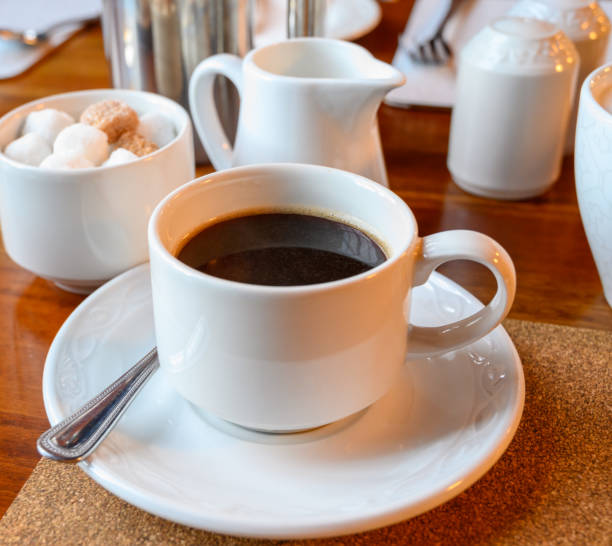istock White cup with black coffee and  hot milk jug 1213351577