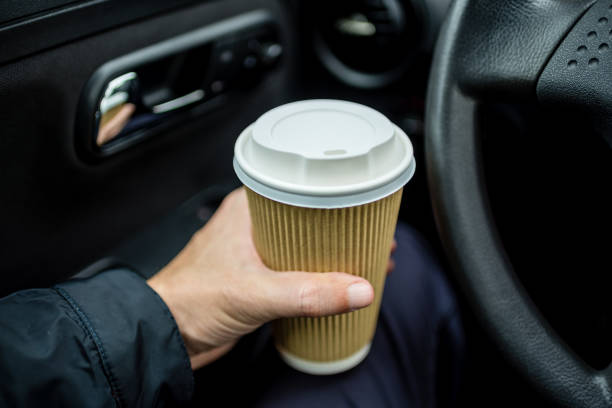 istock Holding a cup of a drink 1213351834