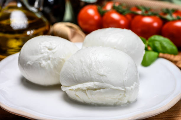 istock Cheese collection, white italian mozzarella cheese balls for salad or for appetizer snacks from deli shop in New York, USA 1213352030