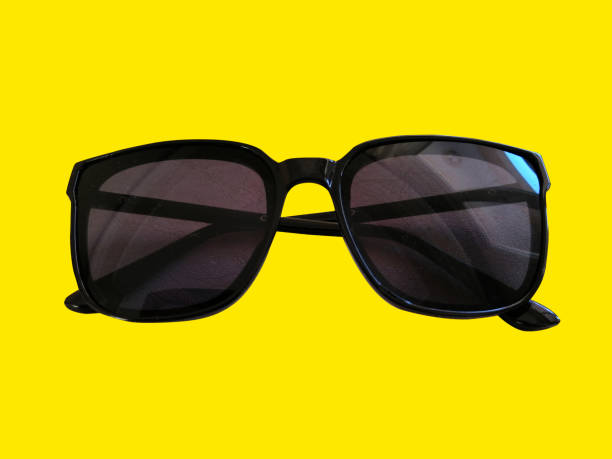 istock Sunglasses on the yellow background 1213356137