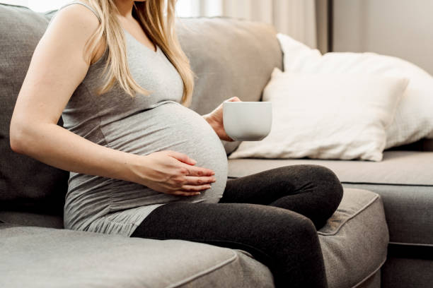 istock Pregnant Woman Drinking Coffee/Tea 1213367649