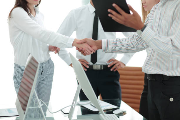 istock strong handshake between man and woman, both sides viewpoints and interests have been considered. 1213369882