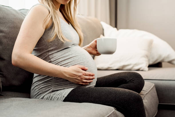 istock Pregnant Woman Drinking Coffee/Tea 1213370846