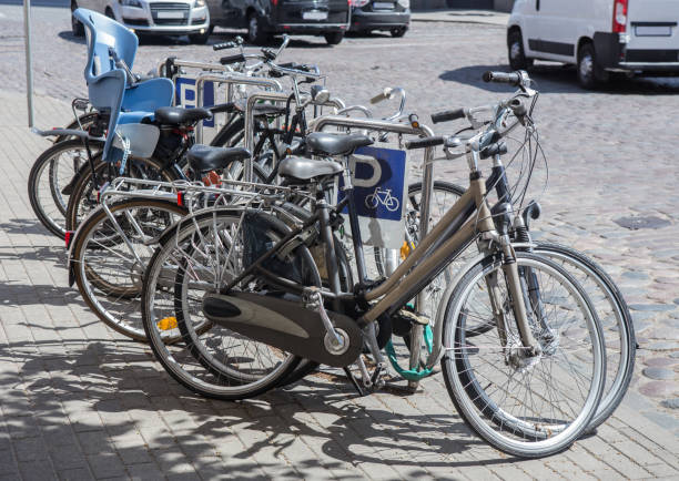 istock Bicycles on a bike park on the sidewalk 1213371005