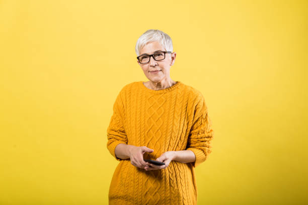 istock Lady standing and using the phone 1213371788