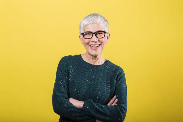 istock Happy lady standing and smiling 1213371814