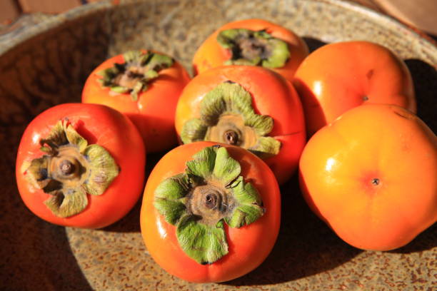 istock Persimmons in a Wide Bowl 1213371862