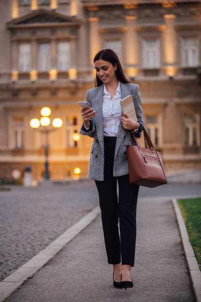 istock Lady walking down the street 1213374873