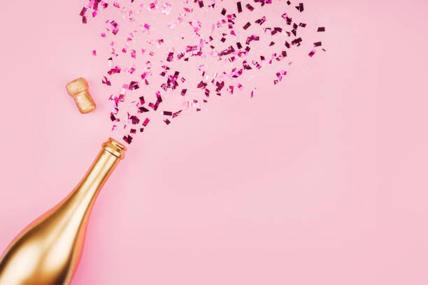 Bottle of champagne and confetti.