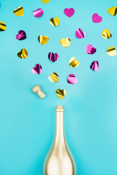 istock Bottle of champagne and confetti. 1213375122