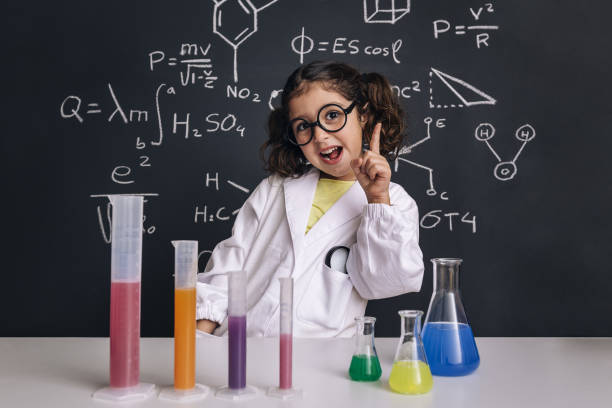 istock funny scientist child in lab coat having an idea 1213375205