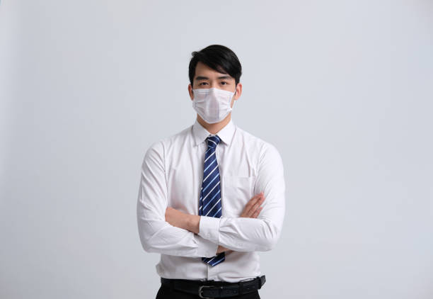 istock businessman man wearing protective mask against cold flu virus bacteria infection pollution 1213375643