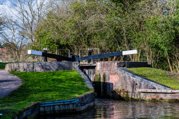 istock canal towpath green lush river scenery and landscape 1213377744