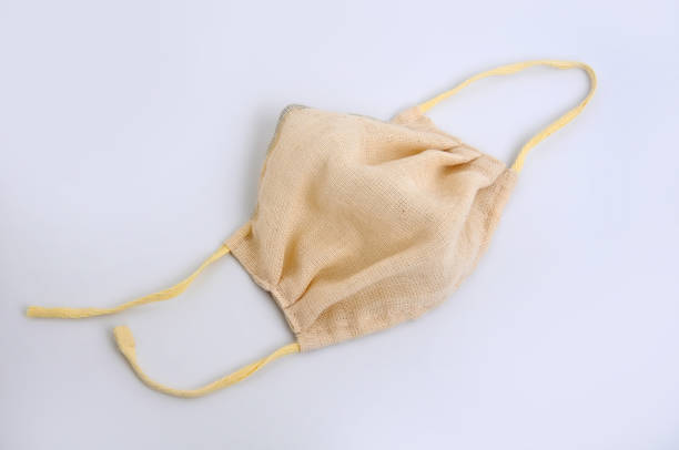 istock Gauze medical mask, isolated on a white background 1213381138