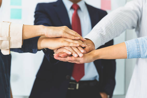 istock Success teamwork of partnership concept, hands stacked together. 1213383589