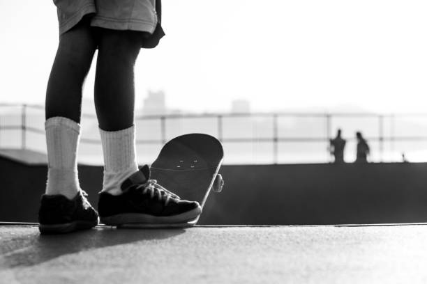 istock Skateboarder getting ready to drop a ramp in a skatepark 1213383614