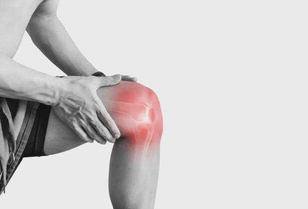 istock Joint pain, Arthritis and tendon problems. a man touching nee at pain point, on white background 1213394252