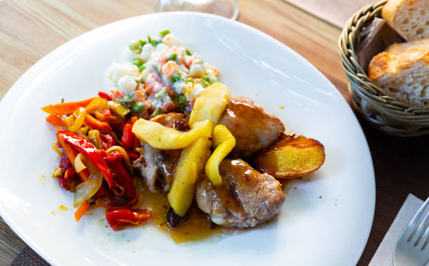 istock Grilled pork sirloin with caramelized apple, peppers and salad 1213396434