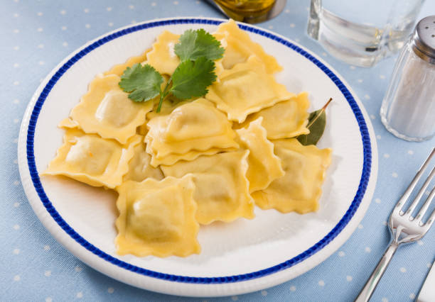 istock Delicious appetizing ravioli with bay leaf and black pepper 1213396450