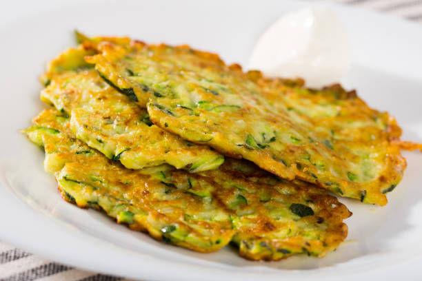 istock Zucchini pancakes with sour cream 1213396488