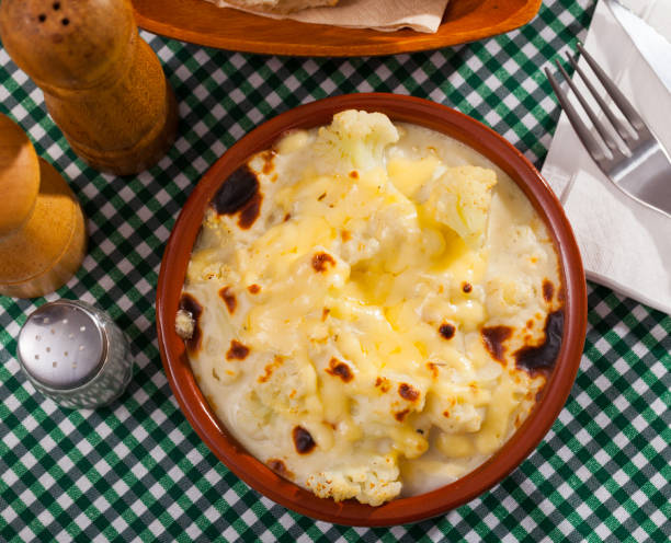 istock Cauliflower baked with bechamel sauce served at clay pot 1213396499