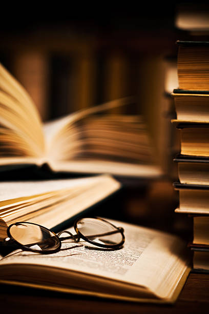 istock opened book, lying on the bookshelf 121339869