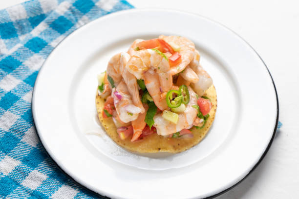 istock Mexican shrimp ceviche toast also called tostada on white background 1213400389