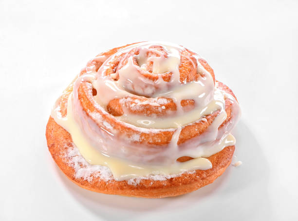 istock bun snail close-up poured by thick custard cream on neutral background 1213402833
