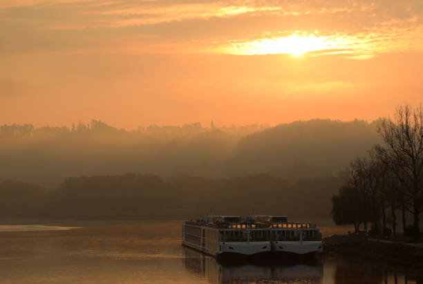 Sunrise on Danube River in Passau Germany Sunrise on Danube River in Passau Germany
Passau is a town in Lower Bavaria, Germany, also known as the Dreiflüssestadt ("City of Three Rivers") because the Danube is joined there by the Inn River from the south and the Ilz River from the north. inn river stock pictures, royalty-free photos & images