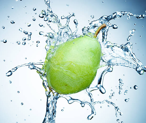 istock pear in spray of water. 121340532