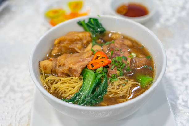 istock Delicious Chinese styled braised beef noodle soup on white background 1213415713