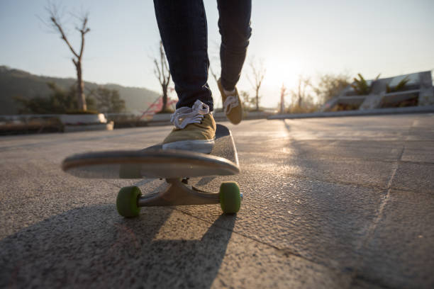 istock Skateboarder skateboarding at sunrise park 1213416076