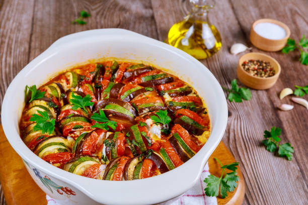 istock Baked vegetable ratatouille with mozzarella cheese in white oven pan. 1213419579
