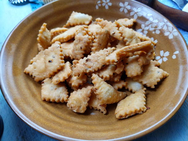 istock Namakpara (Khurma, Nimki, Mathri) which are  crispy, crunchy and savory strips in a bowl. 1213420916