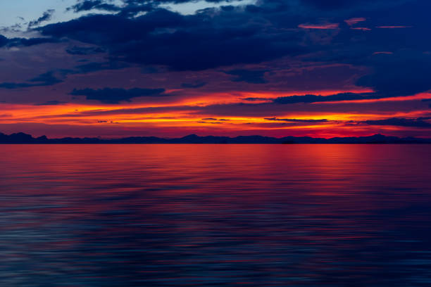 istock Beautiful seascape after sunset sky with color clouds 1213424311
