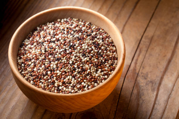 istock Mixed quinoa seeds in wooden bowl 1213424804