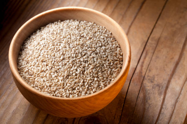 istock Sesame seeds in wooden bowl 1213424831