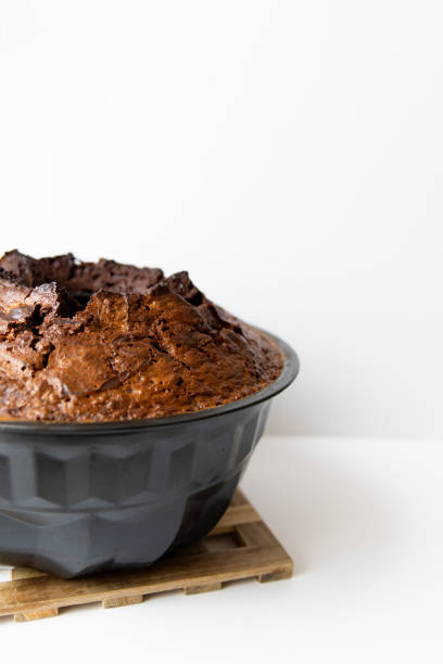 istock Homemade chocolate cake on Wooden Table Protector against black Background. 1213424932