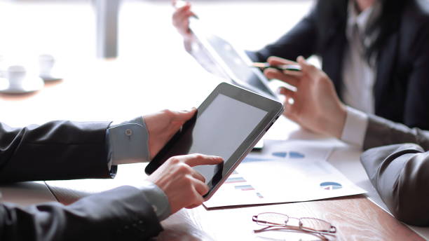 istock businessman uses digital tablet to check financial data 1213427883