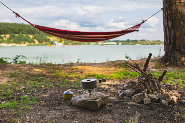 istock view of camping near lake with hammock between trees copy space 1213428534