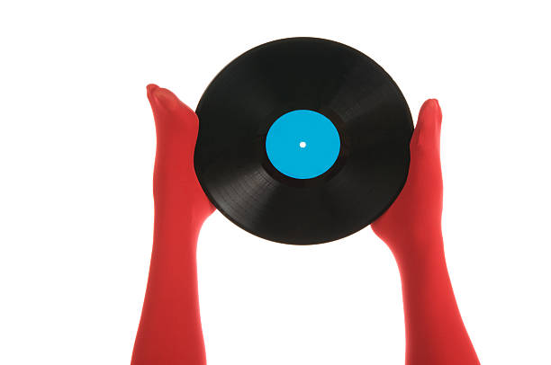 istock Female feet with vinyl record 121342915